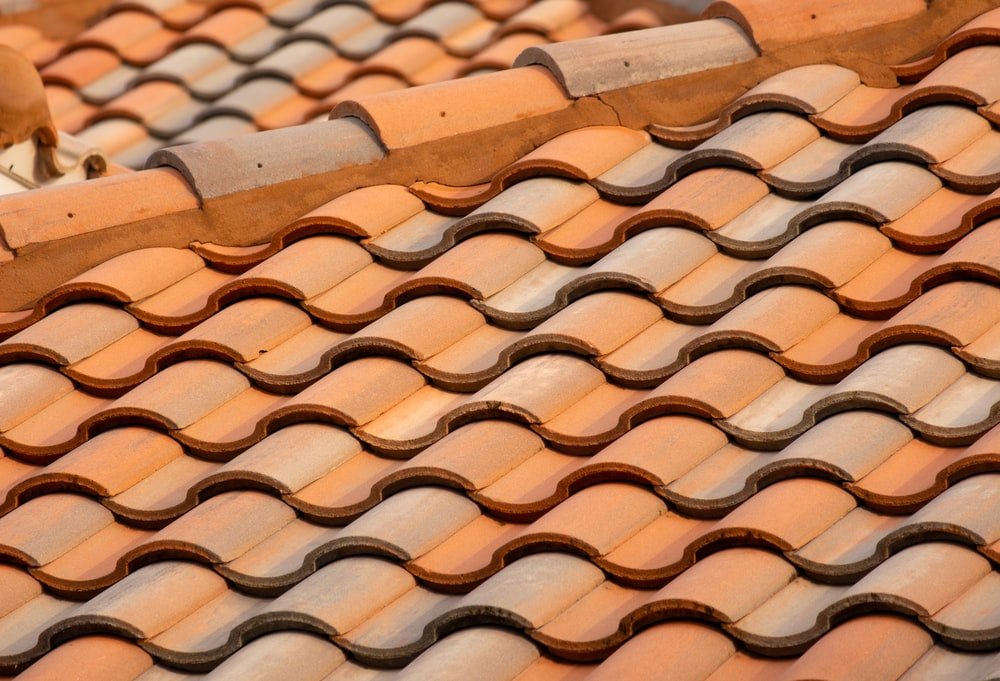 How much does it cost to replace a tile roof with tin?